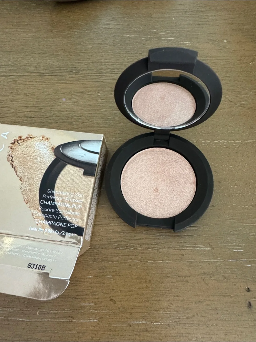 BECCA Champagne Pop Pressed Highlighter — Gold Tone